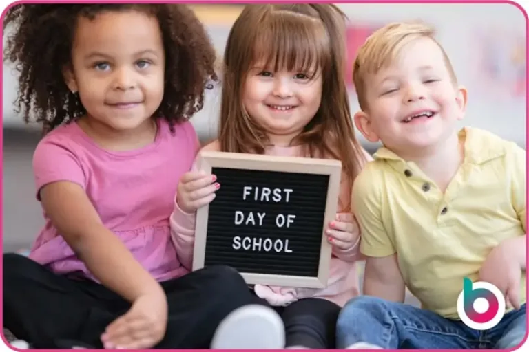 School-readiness-image-children-holding-up-a-board-saying-First-Day-of-School